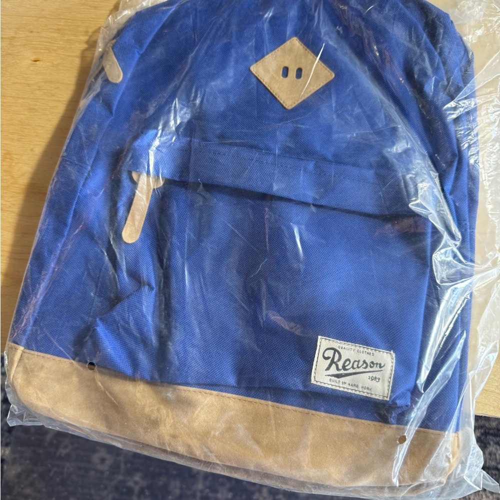 Reason NYC brand Backpack Blue and Tan Great gift.  Lightweight Front pocket